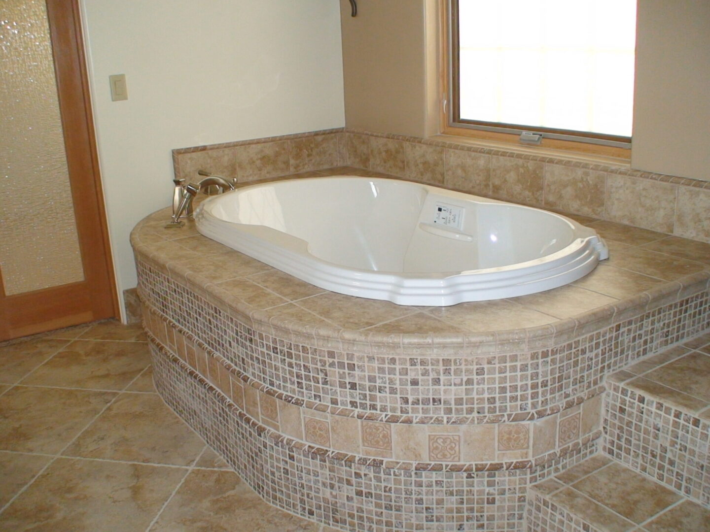 Closeup view of the bath tub on granite stone